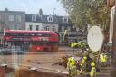 Emergency responders surround a car in Barking Road after the crash on October 15