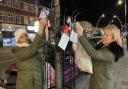 Victoria Burke and Melissa Page putting up hearts in Chadwell Heath