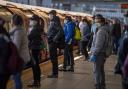 Passengers wearing face masks on a platform at Canning Town underground station in London. Picture: Victoria Jones/PA Images