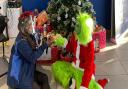 Andrea Thomas, commercial van sales executive at TrustFord, with Junior Miss Galaxy Essex Amber Hood dressed as the Grinch