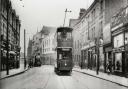 A tram running through Barking town centre.