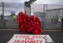 Members of the Red Rebel Brigade outside the Scottish Events Campus stage a  protest outside the COP26 summit