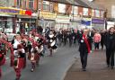 The Dagenham Girl Pipers lead this morning's Remebrance Sunday march through Dagenham.