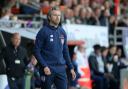 Dagenham & Redbridge boss Daryl McMahon looks on