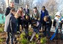 Children burying their 'time capsule' at Barking Abbey for future generations to find (pictrure: Melissa Page)