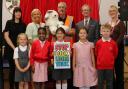 Al Cadabra (centre, back) with children and teachers after one of his magic shows