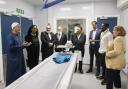 Council officials and faith leaders in the scanning room