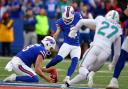 Buffalo Bills’ kicker Tyler Bass, centre, kicks a game-winning field goal against the Miami Dolphins (Adrian Kraus/AP)