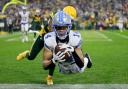 Detroit Lions wide receiver Amon-Ra St Brown catches a touchdown pass (Matt Ludtke/AP)