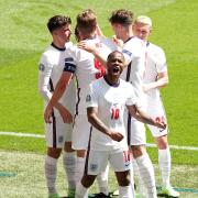 Raheem Sterling celebrates scoring England's goal with team-mates during the UEFA Euro 2020 Group D match against Croatia.