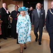 Queen Elizabeth II and the Duke of Edinburgh arrive for their visit to Broadway Theatre in Barking.