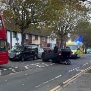 An upturned car at the scene of the crash in Heathway, Dagenham.