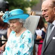 Queen Elizabeth II and the Duke of Edinburgh arrive for their visit to Broadway Theatre in Barking. Picture: PA