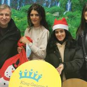 Jas Kallah with husband Sati, daughter Davina and sister Nerinder (right) donating chocolates to King George and Queen's Hospitals Charity.