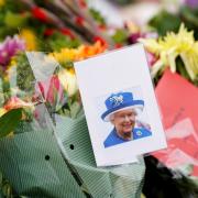 Flowers are laid outside of Windsor Castle following the death of Queen Elizabeth II