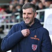 Ben Strevens is all smiles at his first game as Dagenham & Redbridge manager