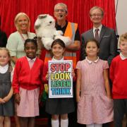 Al Cadabra (centre, back) with children and teachers after one of his magic shows