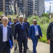 Mayor Lutfur Rahman (centre) on walkabout tour of the Poplar Riverside development