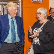 Sir Trevor chats with shoppers at new charity shop