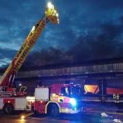 Smoke was seen from surrounding areas as the fire went on through the night