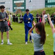 Students from Barking & Dagenham College put Rush Green Primary schoolchildren through their paces