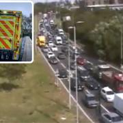 A man has been taken to hospital after emergency services received calls saying he was standing at a bridge over the A406