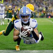 Detroit Lions wide receiver Amon-Ra St Brown catches a touchdown pass (Matt Ludtke/AP)