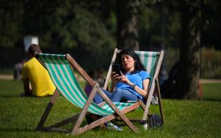 People enjoy the sun in St James's Park, London, last year. Parts of the UK could see an official heatwave in the coming days, forecasters have said