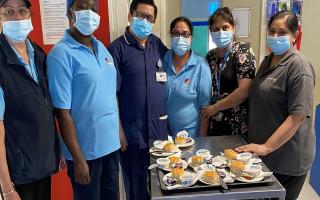 Staff on Iris ward at King George Hospital with scones