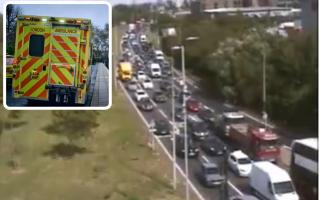 A man has been taken to hospital after emergency services received calls saying he was standing at a bridge over the A406