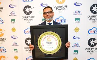 Clay Oven owner Millul Chowdhury celebrates winning the best takeaway award for the second year running