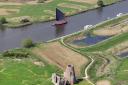 Wherry Albion passing St Benets Abbey, near to the sewer outfall