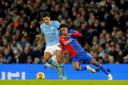 Manchester City's Rodri battles for the ball with Crystal Palace's Matheus Franca during the