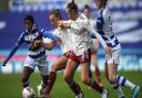 Reading's Danielle Carter, Arsenal's Katie McCabe, Caitlin Foord and Reading's Emma Harries battle for the ball sduring the FA Women's Super League match at Madejski Stadium, Reading.