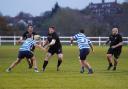 Dagenham's Jason Taylor passes to Mitch Sinfield against Wanstead