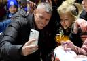 West Ham United Women's manager Paul Konchesky with a young fan