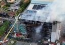 This dramatic photos shows severe fire damage to a block of flats on Freshwater Road in Dagenham today (August 26)