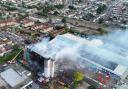 Dramatic photos reveal the severe damage to a block of flats by fire in Dagenham today (August 26)