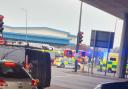 Emergency services were pictured at the scene near the roundabout this morning