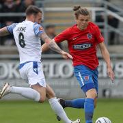 Matt Robinson of Dagenham and Redbridge and James Dunne of Southend United