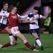 Arsenal's Vivianne Miedema (centre) scores her side's first goal of the game during the Continental Cup match at Meadow Park, London.