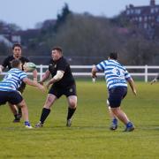 Dagenham's Jason Taylor passes to Mitch Sinfield against Wanstead