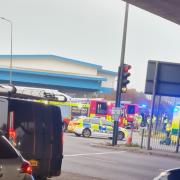 Emergency services were pictured at the scene near the roundabout this morning