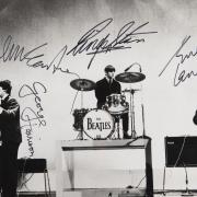 Beatles portrait by Dezo Hoffman, signed by the ‘Fab Four’ for their 1964 Australian tour promoter (RR Auction/PA)