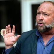 FILE – Right-wing conspiracy theorist Alex Jones speaks outside the federal courthouse after a bankruptcy hearing Friday, June 14, 2024, in Houston. (AP Photo/David J. Phillip, File)