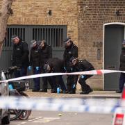 Police officers search the scene on Southern Grove in Ladbroke Grove, west London, after an eight-year-old girl was seriously injured when she was shot in an ‘appalling incident’ (Aaron Chown/PA)