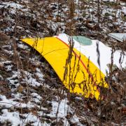 The plane skidded into a house after the crash, but no-one on the ground was hurt (AP)