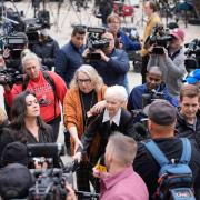 Erik and Lyle Menendez’s aunt Joan VanderMolen, centre, arrives to attend a hearing at the Van Nuys courthouse in Los Angeles (Damian Dovarganes/AP)