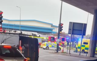 Emergency services were pictured at the scene near the roundabout this morning